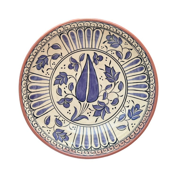 The Voyage Dubai - Hand-painted Iznik ceramic bowl by acclaimed Turkish artist Adil Can Güven. The bowl is painted in a traditional Iznik style featuring a blue and white floral design.