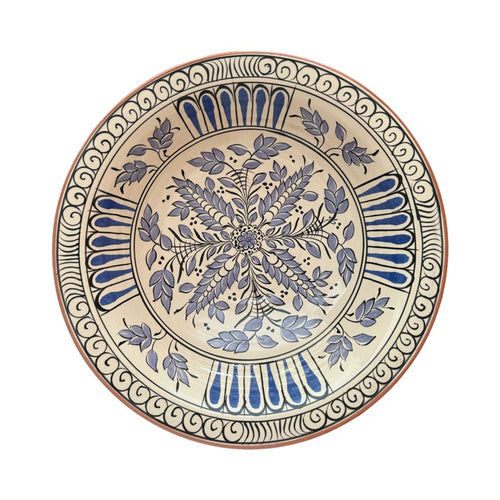 The Voyage Dubai - Hand-painted Iznik ceramic bowl by acclaimed Turkish artist Adil Can Güven. The bowl is painted in a traditional Iznik style featuring a blue and white floral design.