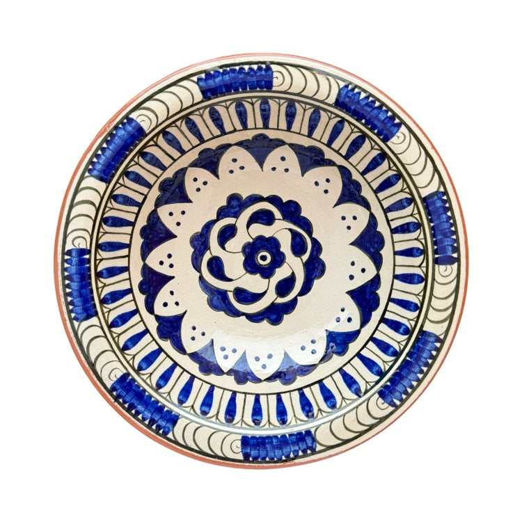 The Voyage Dubai - Hand-painted Iznik ceramic bowl by acclaimed Turkish artist Adil Can Güven. The bowl is painted in a traditional Iznik style featuring a blue and white floral design.