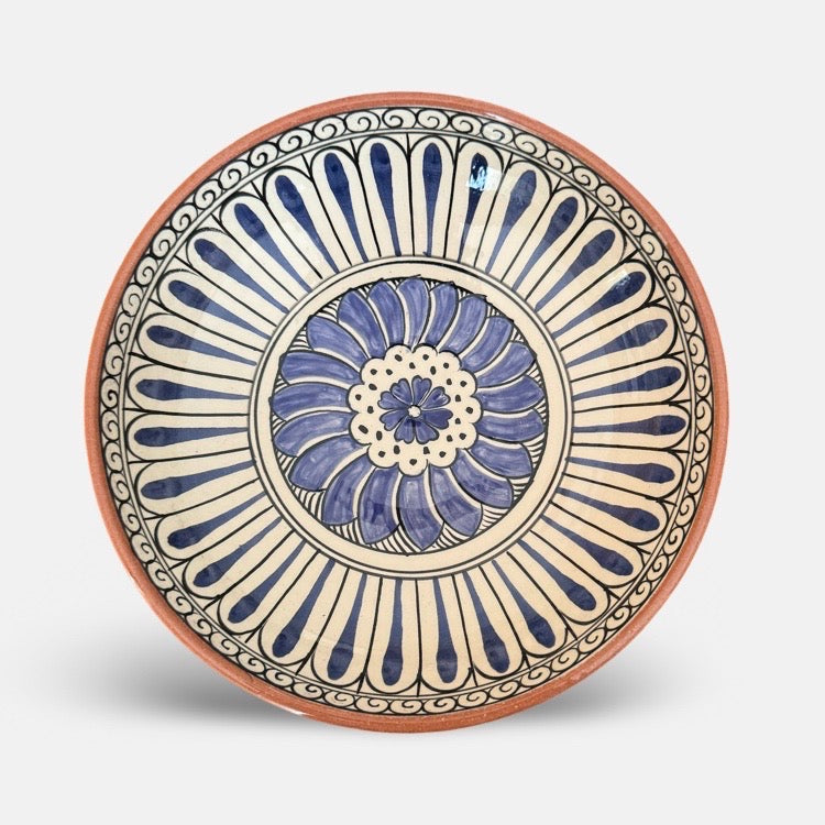 The Voyage Dubai - Hand-painted Iznik ceramic bowl by acclaimed Turkish artist Adil Can Güven. The bowl is painted in a traditional Iznik style featuring a blue and white floral design.