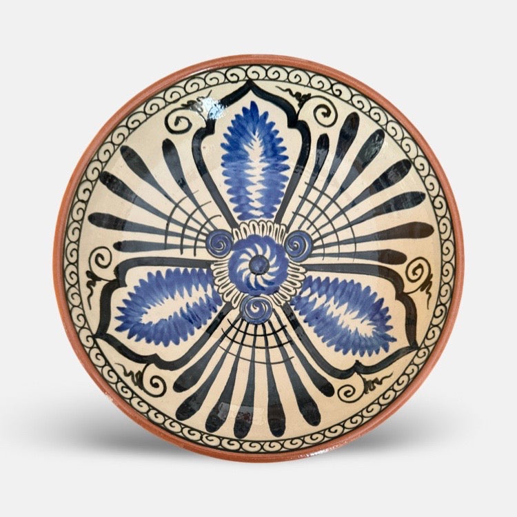 The Voyage Dubai - Hand-painted Iznik ceramic bowl by acclaimed Turkish artist Adil Can Güven. The bowl is painted in a traditional Iznik style featuring a blue and white floral design.