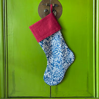 The Voyage Dubai - Chic and festive, our limited edition Christmas Tree stockings are made from Volga Linen's blue Aloysha print and finished with a contrasting European linen burgundy cuff and hook. The stockings are fully lined to hold their shape.