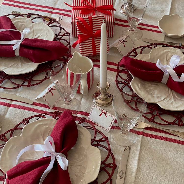 The Voyage Dubai - Lunch in Tangier Tablecloth - Red and White Stripe Tablecloth Made from a wonderfully soft yet highly durable handwoven cotton, the Lunch in Tangier tablecloth is perfect for everyday use and equally stunning dressed up for a special occasion. A truly versatile piece that will have you reaching for it time and time again.