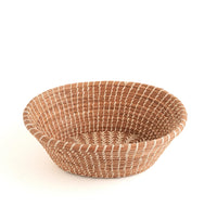 The Voyage Dubai - Handmade by skilled artisans in Guatemala, the Rosa basket is delicately handwoven from native grass and pine needles with raffia accents. Functional as well as beautiful, the Rosa is perfect as a bread basket or decorative piece.  Handmade and fair trade.