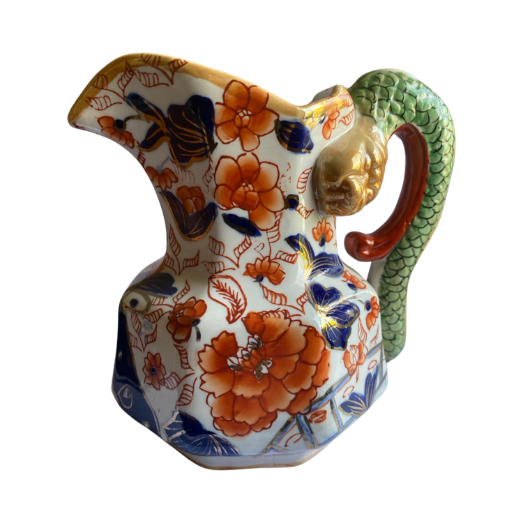 The Voyage Dubai - Antique Mason's Ironstone Imari Jug A rare, antique Mason's Ironstone Hydra Jug with a superb serpent handle in a lovely Imari Pattern. The jug has the octagonal "hydra" shape with a notched snake handle and is decorated in distinctive cobalt blue and floral pattern, which is one of Mason's well known chinoiserie patterns, using bold hand painted enamels of cobalt blue, green and burnt orange all in various shades.