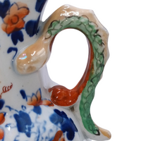 The Voyage Dubai - Antique Mason's Ironstone Imari Jug  A rare, antique Mason's Ironstone Hydra Jug with a superb serpent handle in a lovely Imari Pattern.  The jug has the octagonal "hydra" shape with a notched snake handle and is decorated in distinctive cobalt blue and floral pattern, which is one of Mason's well known chinoiserie patterns, using bold hand painted enamels of cobalt blue, green and burnt orange all in various shades.