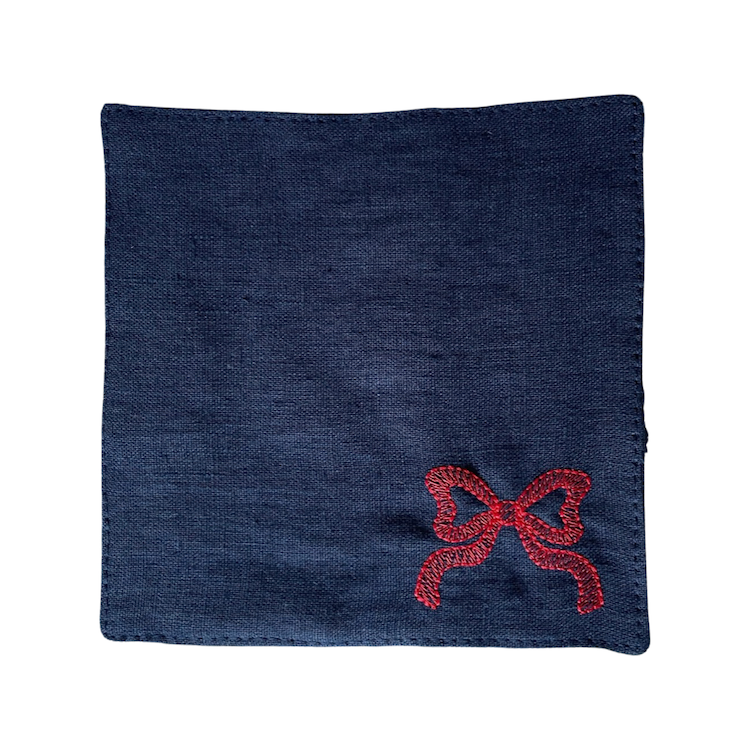 The Voyage Dubai - Red Tie Cocktail Napkins in Navy A classic navy and white pairing with beautifully embroidered bow motifs. Great for any season, perfect for Christmas! Our cocktail napkins are handcrafted from 100% European linen that has been stonewashed and softened giving them a wonderful, luxurious feel. The cocktail napkins come beautifully presented making for the perfect gift.